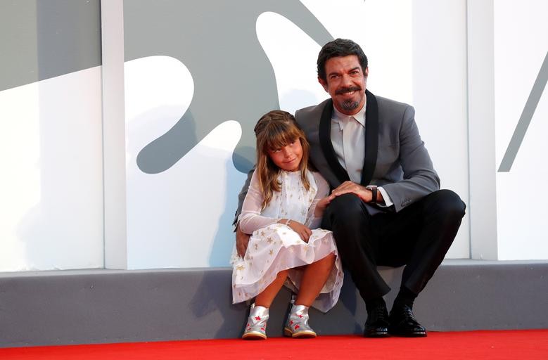 Actor Pierfrancesco Favino and his daughter Lea pose during the screening of the film "Padrenostro", September 4. REUTERS/Yara Nardi